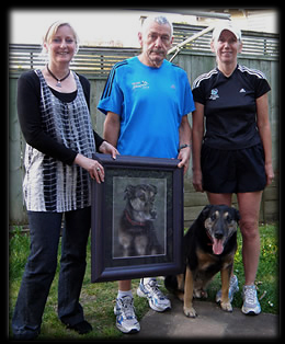 Pet portrait painting of Austin. Artist Karen Neal pictured with owners Bob & Dorothy Cox, and Austin, of Auckland.